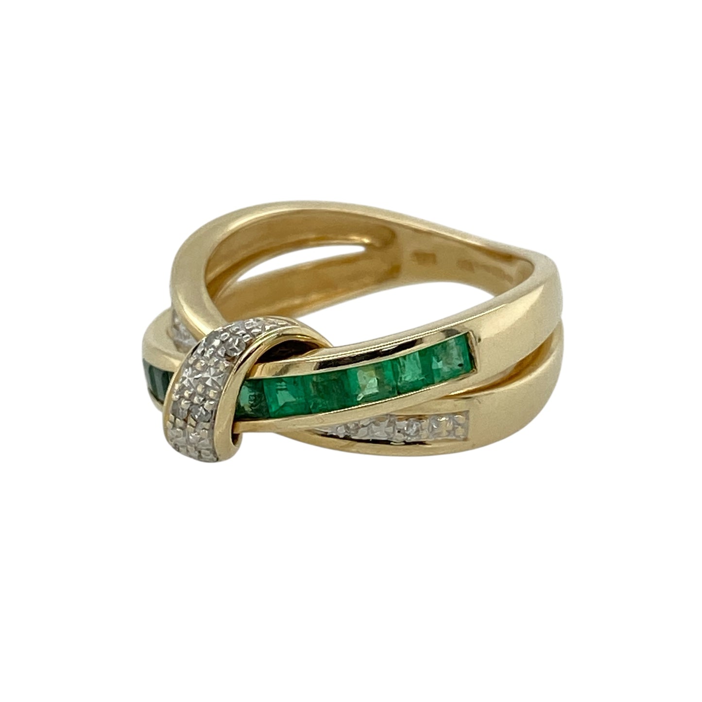 Bring vibrant elegance and flowing design to your collection with this pre-owned 9ct yellow gold diamond and emerald crossover ring—a graceful piece with timeless appeal.

Design: This ring features a stylish crossover design with one band set with vivid emeralds and the other with sparkling diamonds, creating a balanced and eye-catching contrast.
Material: Made from 9-carat yellow gold, the polished finish enhances the brilliance of the diamonds and the rich green of the emeralds.