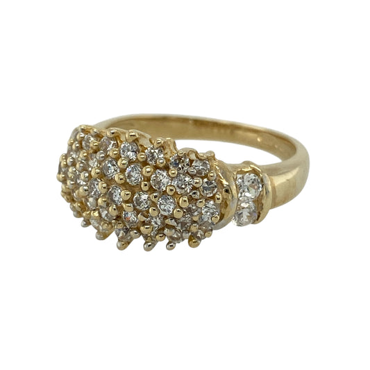 Bring classic sparkle and confident style to your jewellery collection with this pre-owned 9ct yellow gold cubic zirconia set cluster ring, offering a bold yet elegant design—perfect for everyday wear or special occasions.

Design: The ring features a cluster arrangement of cubic zirconia stones forming a bright and eye-catching focal point. The front of the ring measures approximately 11mm in height, giving it a strong and elegant presence on the hand.