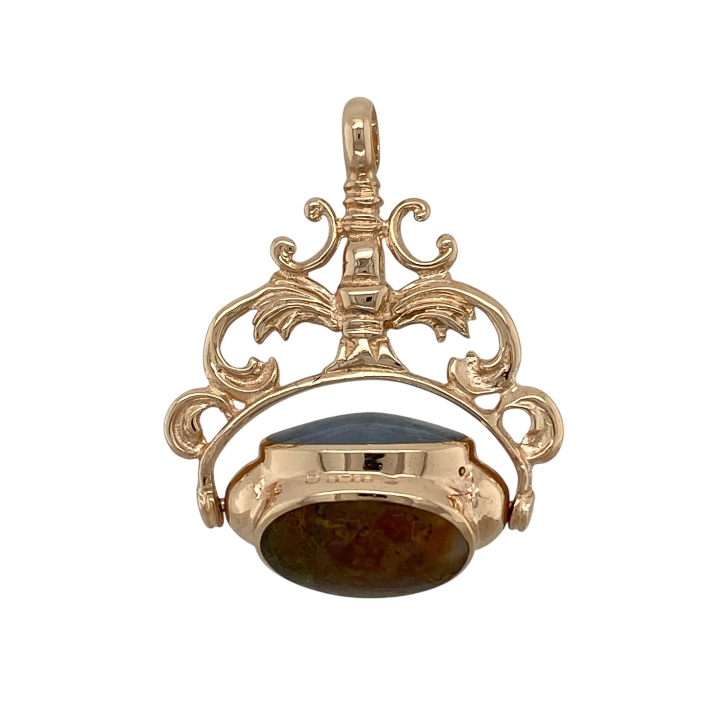 Bring vintage character and unique colour to your jewellery collection with this pre-owned 9ct yellow gold gemstone set spinning fob pendant, offering a classic design with distinctive charm—perfect for statement wear or collectors of traditional jewellery.

Design: The pendant features a traditional spinning fob design, showcasing three oval agate gemstones in contrasting colours: one aqua blue, one predominantly brown/red, and one white/brown.
