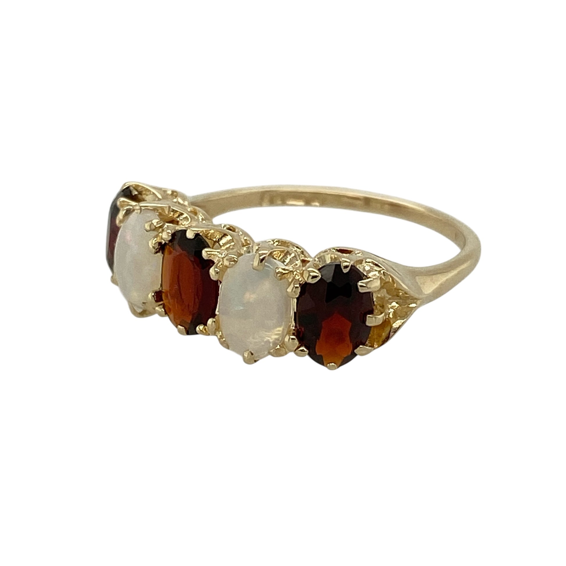 Bring vintage charm and soft, glowing colour to your jewellery collection with this pre-owned 9ct yellow gold garnet and opalique set ring, combining classic elegance with a timeless decorative style—perfect for everyday wear or special occasions.

Design: The ring features a vintage-inspired arrangement with a rich red garnet paired alongside an opalique gemstone, each measuring approximately 6mm by 4mm, creating a beautifully balanced and eye-catching look.