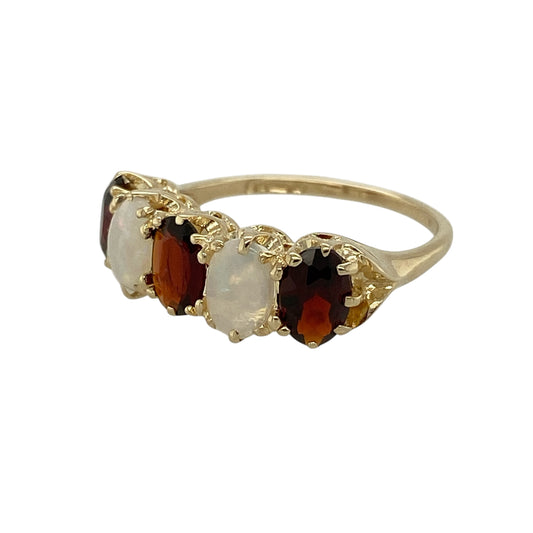 Bring vintage charm and soft, glowing colour to your jewellery collection with this pre-owned 9ct yellow gold garnet and opalique set ring, combining classic elegance with a timeless decorative style—perfect for everyday wear or special occasions.

Design: The ring features a vintage-inspired arrangement with a rich red garnet paired alongside an opalique gemstone, each measuring approximately 6mm by 4mm, creating a beautifully balanced and eye-catching look.