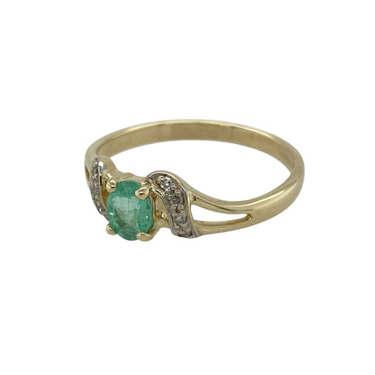 Bring fresh colour and elegant sparkle to your jewellery collection with this pre-owned 9ct yellow gold diamond and green stone set twist ring, combining flowing design with a vibrant focal point—perfect for everyday wear or special occasions.

Design: The ring features a graceful twist-style band highlighted by an oval green stone measuring approximately 5mm by 4mm, accented with diamond detailing for added brilliance.