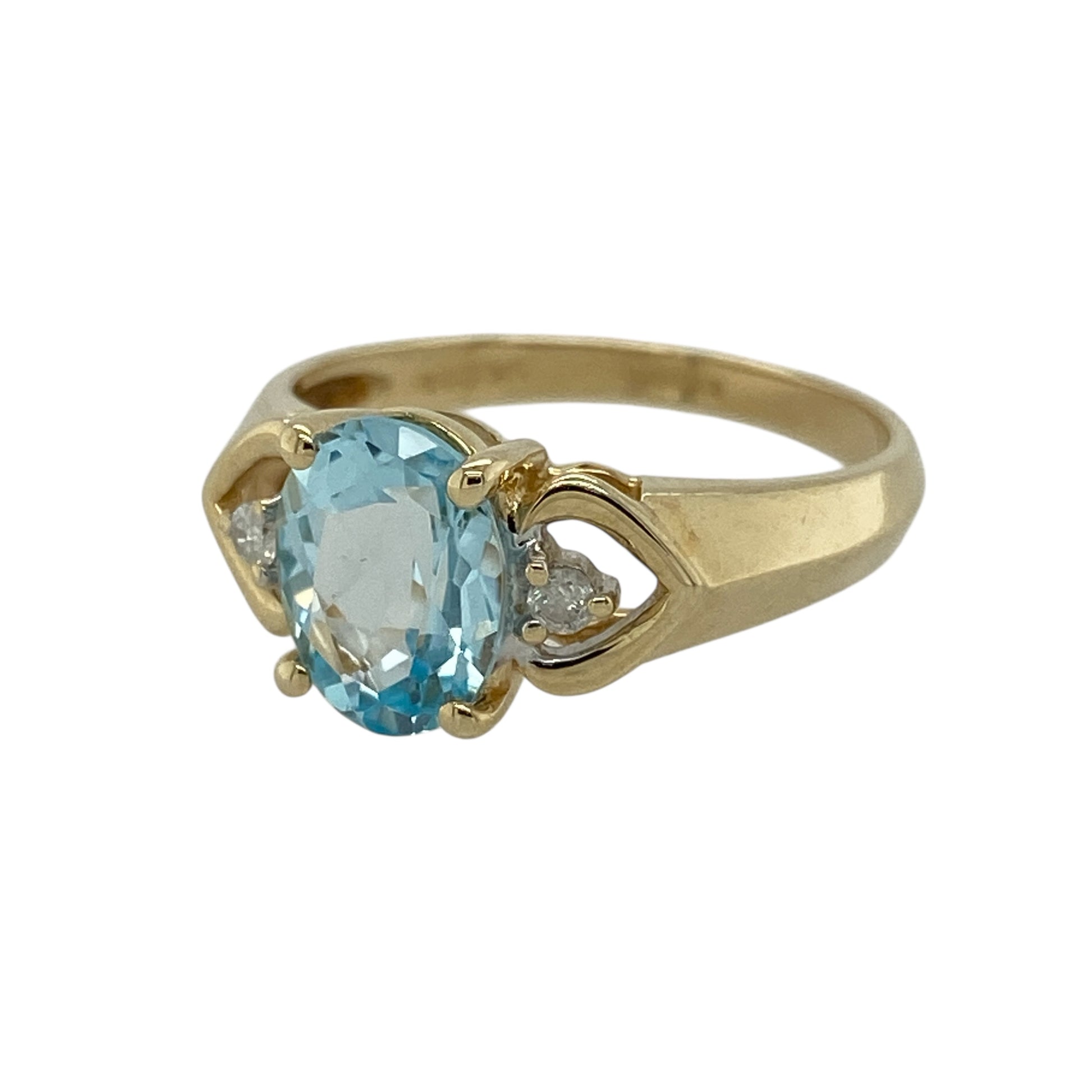 Bring soft colour and elegant sparkle to your jewellery collection with this pre-owned 9ct yellow gold diamond and aqua coloured stone set ring, offering a refined design with a striking focal point—perfect for special occasions or everyday elegance.

Design: The ring features a prominent oval aqua coloured stone measuring approximately 9mm by 7mm, accented with diamond detailing to enhance its light-catching appeal.