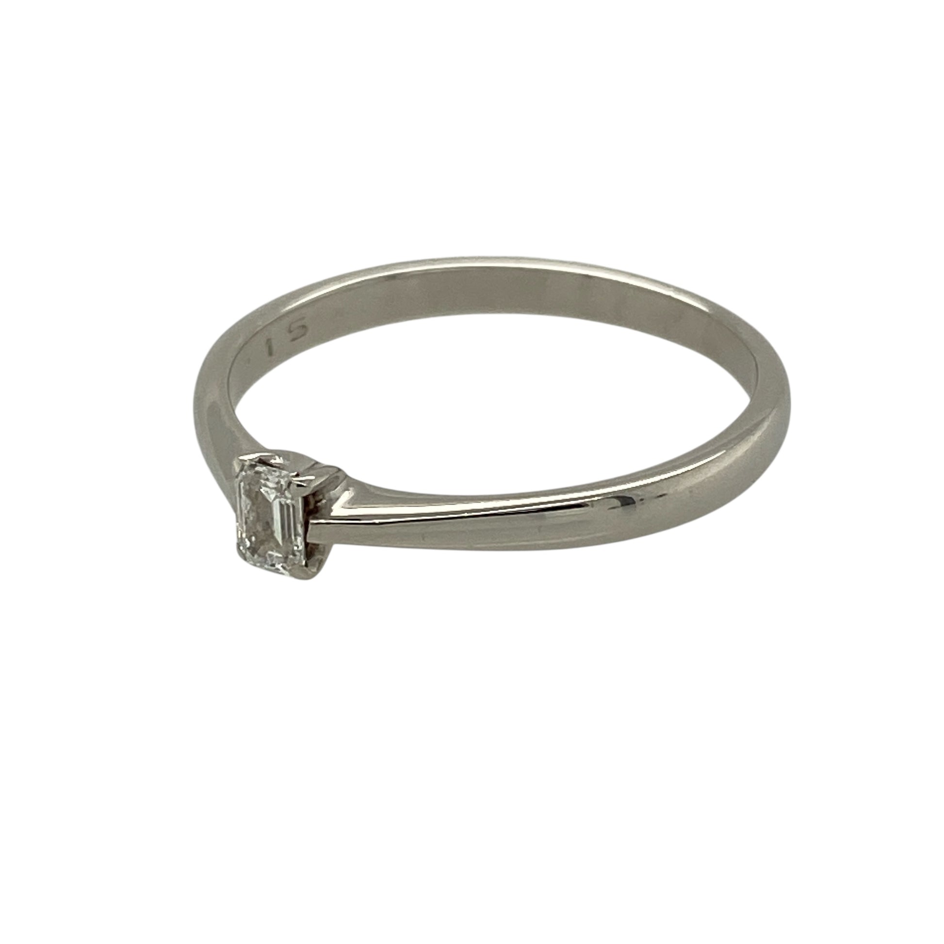Bring refined elegance and clean-lined sparkle to your jewellery collection with this pre-owned 9ct white gold and diamond set emerald cut solitaire ring, offering timeless sophistication with a modern edge—perfect for special occasions or everyday wear.

Design: The ring features a single emerald-cut diamond with an approximate weight of 0.20ct, presented in a classic solitaire style that highlights the diamond’s step-cut facets and elegant shape.