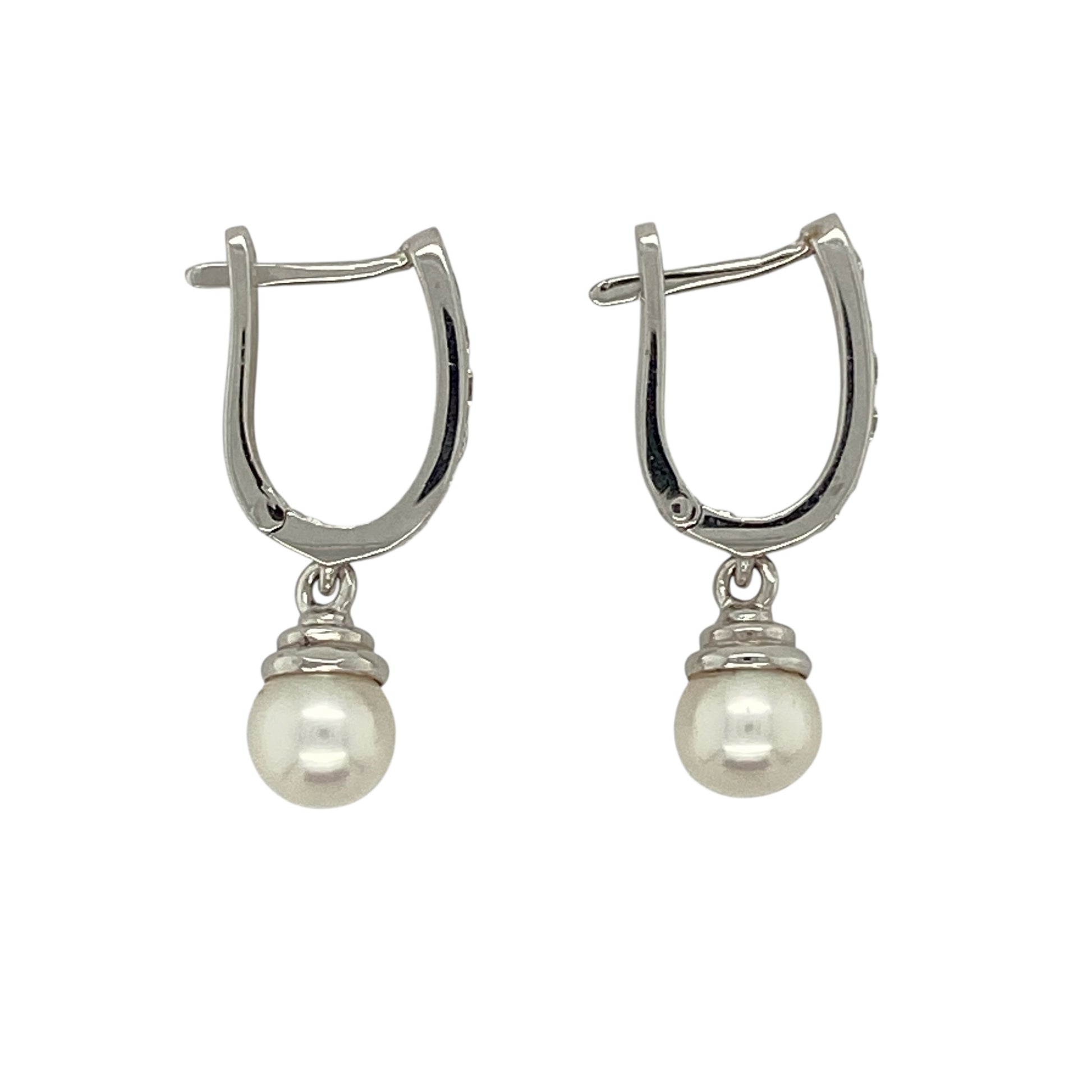 Bring timeless elegance and soft lustre to your jewellery collection with this pre-owned 18ct white gold diamond and pearl drop huggie earrings, combining classic refinement with graceful movement—perfect for special occasions or elevated everyday wear.

Design: The earrings feature diamond-accented huggie hoops with elegant pearl drops, each pearl measuring approximately 6mm in diameter, creating a delicate and sophisticated silhouette.