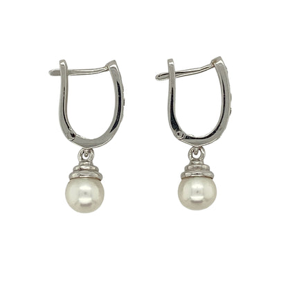 Bring timeless elegance and soft lustre to your jewellery collection with this pre-owned 18ct white gold diamond and pearl drop huggie earrings, combining classic refinement with graceful movement—perfect for special occasions or elevated everyday wear.

Design: The earrings feature diamond-accented huggie hoops with elegant pearl drops, each pearl measuring approximately 6mm in diameter, creating a delicate and sophisticated silhouette.