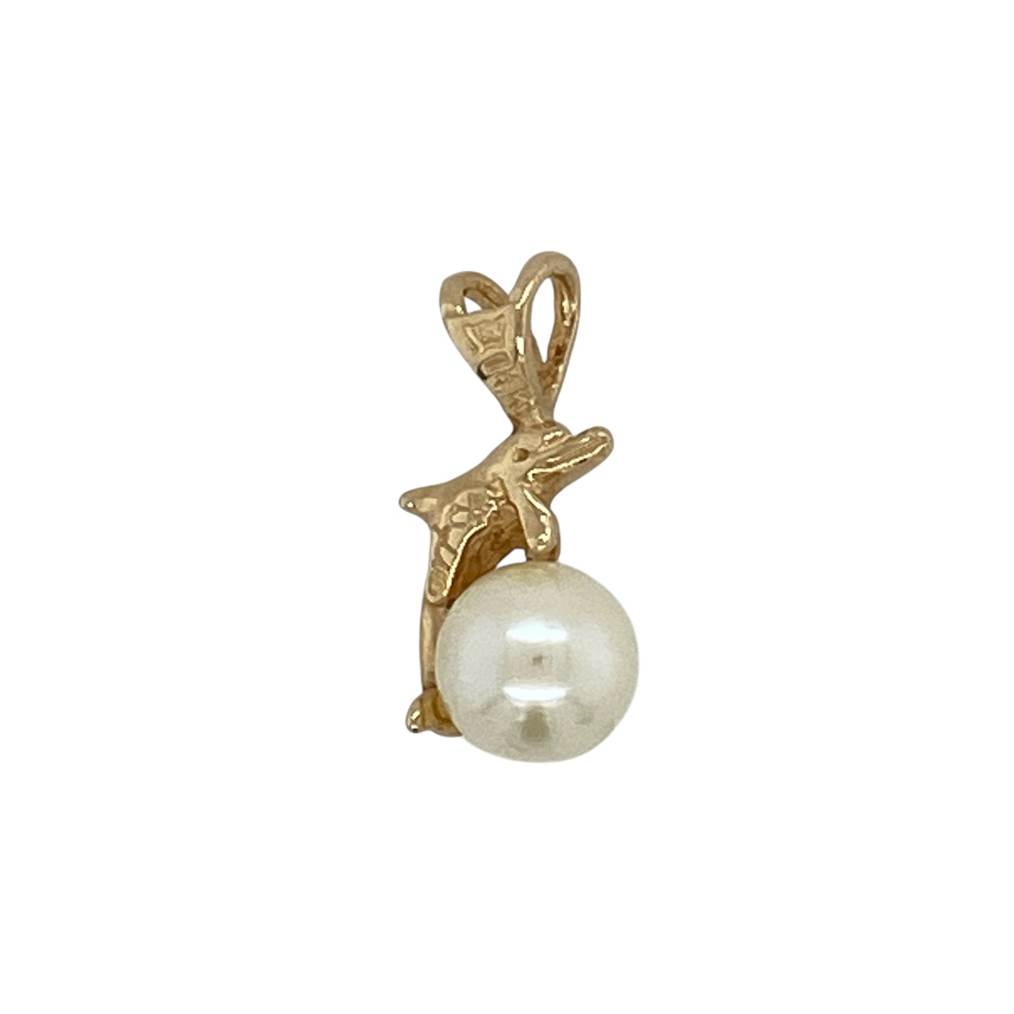 Add a playful yet elegant touch to your jewellery collection with this pre-owned 14ct yellow gold and pearl set dolphin pendant, combining charming symbolism with classic detail—perfect for everyday wear or as a thoughtful gift.

Design: The pendant is styled in a graceful dolphin shape, accented with a pearl that adds soft lustre and contrast to the flowing gold form.
Material: Made from 14-carat yellow gold, the warm polished finish beautifully complements the natural glow of the pearl.
