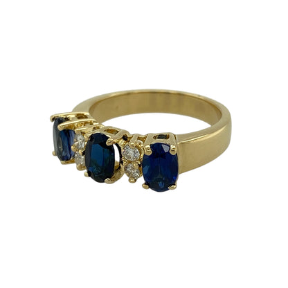 Bring timeless elegance and rich colour to your jewellery collection with this pre-owned 18ct yellow gold diamond and sapphire set trilogy ring, showcasing classic gemstones and refined sparkle—perfect for special occasions or meaningful gifting.

Design: The ring features three oval sapphires, each measuring approximately 6mm by 4mm, arranged in a traditional trilogy style, with two brilliant-cut diamonds set between each sapphire to enhance brilliance and balance.