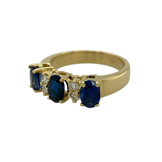 Bring timeless elegance and rich colour to your jewellery collection with this pre-owned 18ct yellow gold diamond and sapphire set trilogy ring, showcasing classic gemstones and refined sparkle—perfect for special occasions or meaningful gifting.

Design: The ring features three oval sapphires, each measuring approximately 6mm by 4mm, arranged in a traditional trilogy style, with two brilliant-cut diamonds set between each sapphire to enhance brilliance and balance.