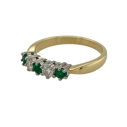 Add refined colour and classic elegance to your jewellery collection with this pre-owned 18ct yellow gold diamond and emerald set band ring, offering a timeless design with delicate sparkle—perfect for everyday wear or special occasions.

Design: The ring features three round emerald stones, each measuring approximately 3mm in diameter, with a sparkling diamond set between each emerald, creating a balanced and elegant band-style arrangement.