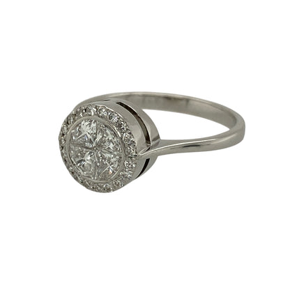 Add exceptional sparkle and elegant presence to your jewellery collection with this pre-owned 18ct white gold and diamond set halo illusion ring, offering a luxurious design with striking brilliance—perfect for special occasions or as a statement engagement ring.

Design: The ring features an illusion-set arrangement of four diamonds forming the appearance of a single round diamond, surrounded by a halo of smaller diamonds to maximise sparkle and visual impact.