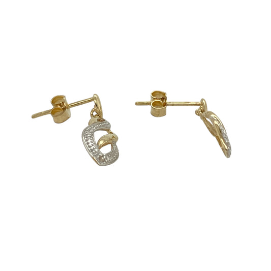 Add graceful movement and subtle sparkle to your jewellery collection with this pre-owned 9ct yellow and white gold and diamond set swirl drop earrings, offering an elegant two-tone design with timeless appeal—perfect for everyday wear or special occasions.

Design: The earrings feature a flowing swirl drop design, combining yellow and white gold tones and accented with diamond detailing for a refined finish.