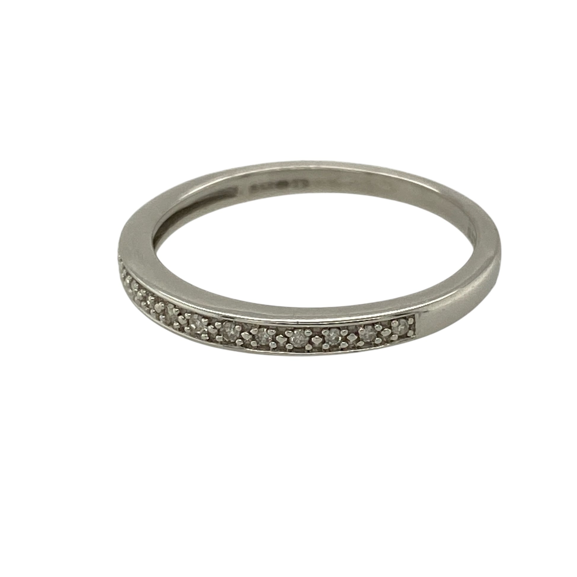Add subtle sparkle and clean-lined elegance to your jewellery collection with this pre-owned 9ct white gold and diamond set band ring, offering a refined design with everyday versatility—perfect for stacking or wearing alone.

Design: The ring features a slim band with a front width of approximately 2mm, accented with diamond detailing for a delicate touch of brilliance.
Material: Made from 9-carat white gold, the cool polished finish beautifully complements the sparkle of the diamonds.