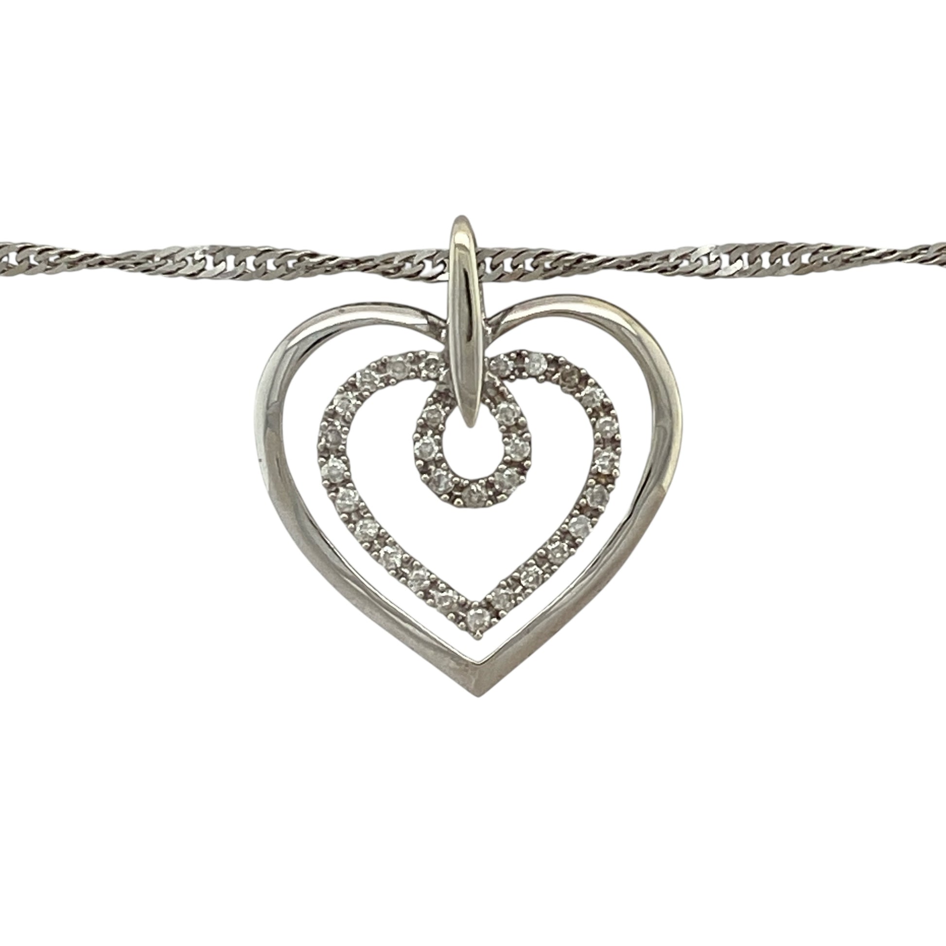 Add romantic elegance and modern sparkle to your jewellery collection with this pre-owned 9ct white gold and diamond set double open heart pendant necklace, offering a meaningful design with graceful movement—perfect for everyday wear or heartfelt gifting.

Design: The necklace features a double open heart pendant accented with diamond detailing, measuring approximately 2.5cm in length including the bail, suspended from an elegant 18" Singapore chain for added shimmer.