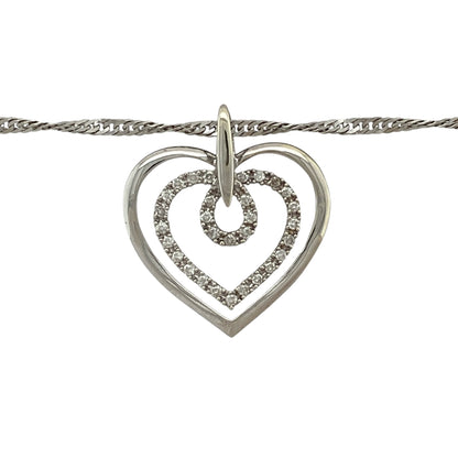 Add romantic elegance and modern sparkle to your jewellery collection with this pre-owned 9ct white gold and diamond set double open heart pendant necklace, offering a meaningful design with graceful movement—perfect for everyday wear or heartfelt gifting.

Design: The necklace features a double open heart pendant accented with diamond detailing, measuring approximately 2.5cm in length including the bail, suspended from an elegant 18" Singapore chain for added shimmer.