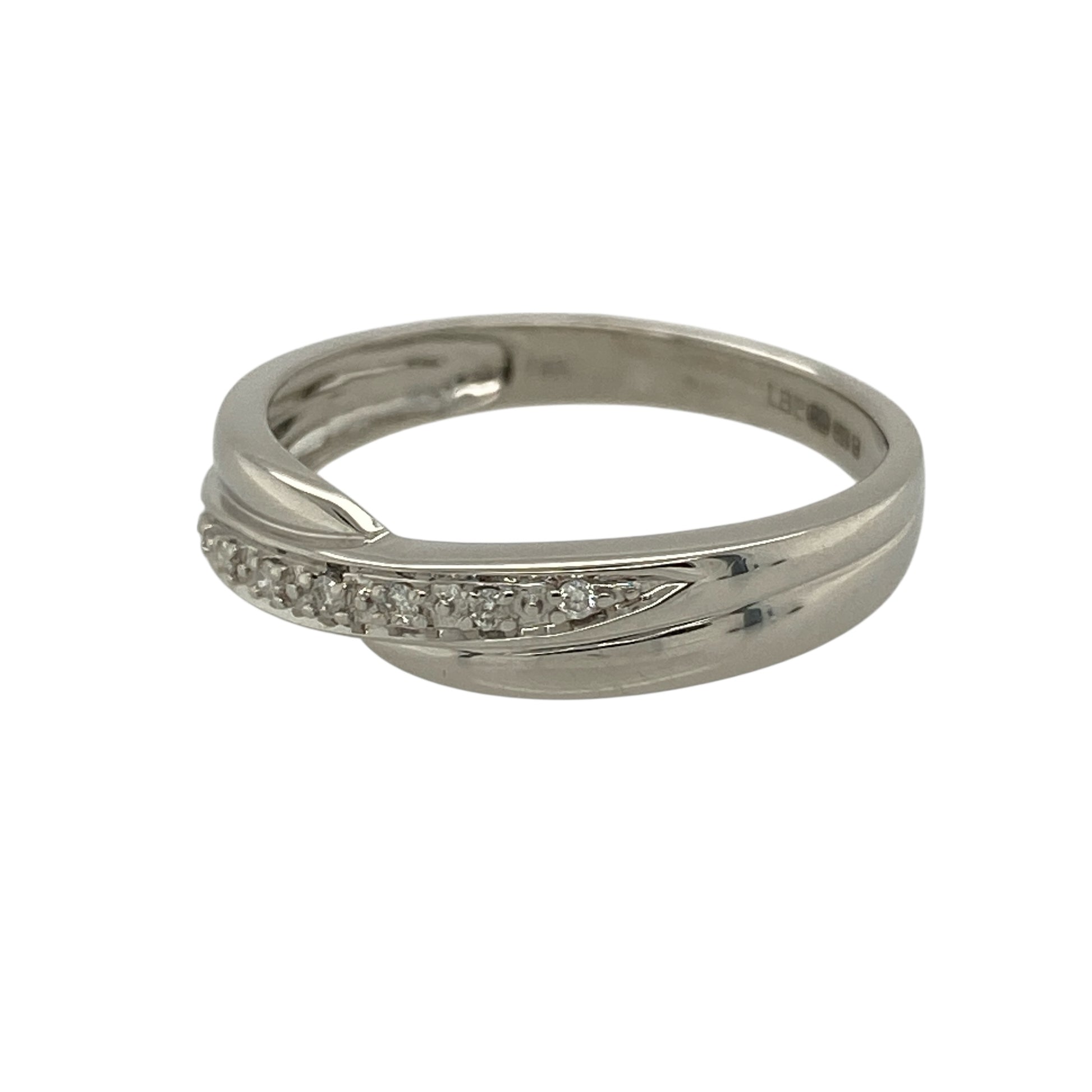 Add flowing elegance and refined sparkle to your jewellery collection with this pre-owned 9ct white gold and diamond set crossover band ring, offering a timeless design with modern appeal—perfect for everyday wear or special occasions.

Design: The ring features a graceful crossover band style with a front width of approximately 4mm, accented with diamond detailing that follows the flowing lines of the design.