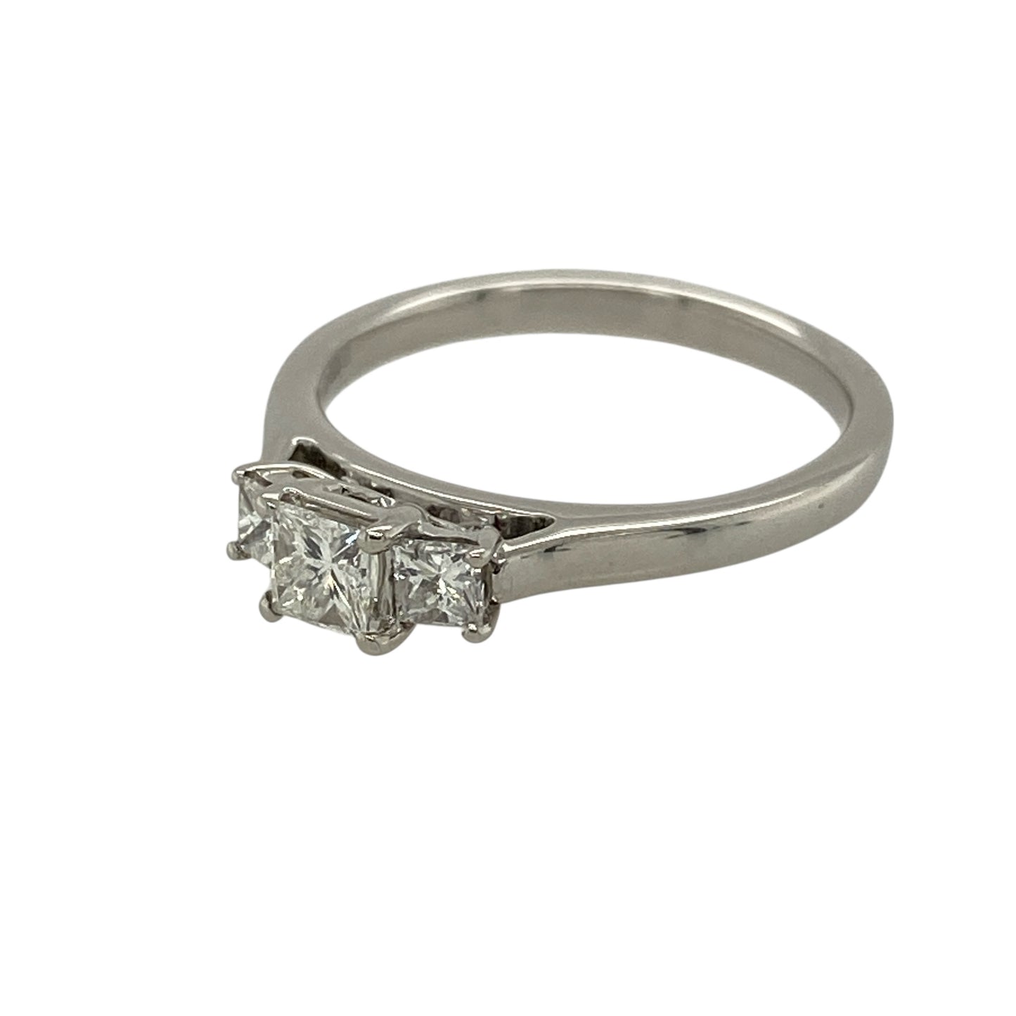 Add striking brilliance and timeless elegance to your jewellery collection with this pre-owned 18ct white gold and diamond set trilogy ring, offering a classic design with exceptional sparkle—perfect for engagements or meaningful gifting.

Design: The ring features a princess-cut diamond trilogy arrangement, with a central diamond of approximately 0.35ct flanked by two matching diamonds of approximately 0.10ct each, creating a beautifully balanced and impactful look.