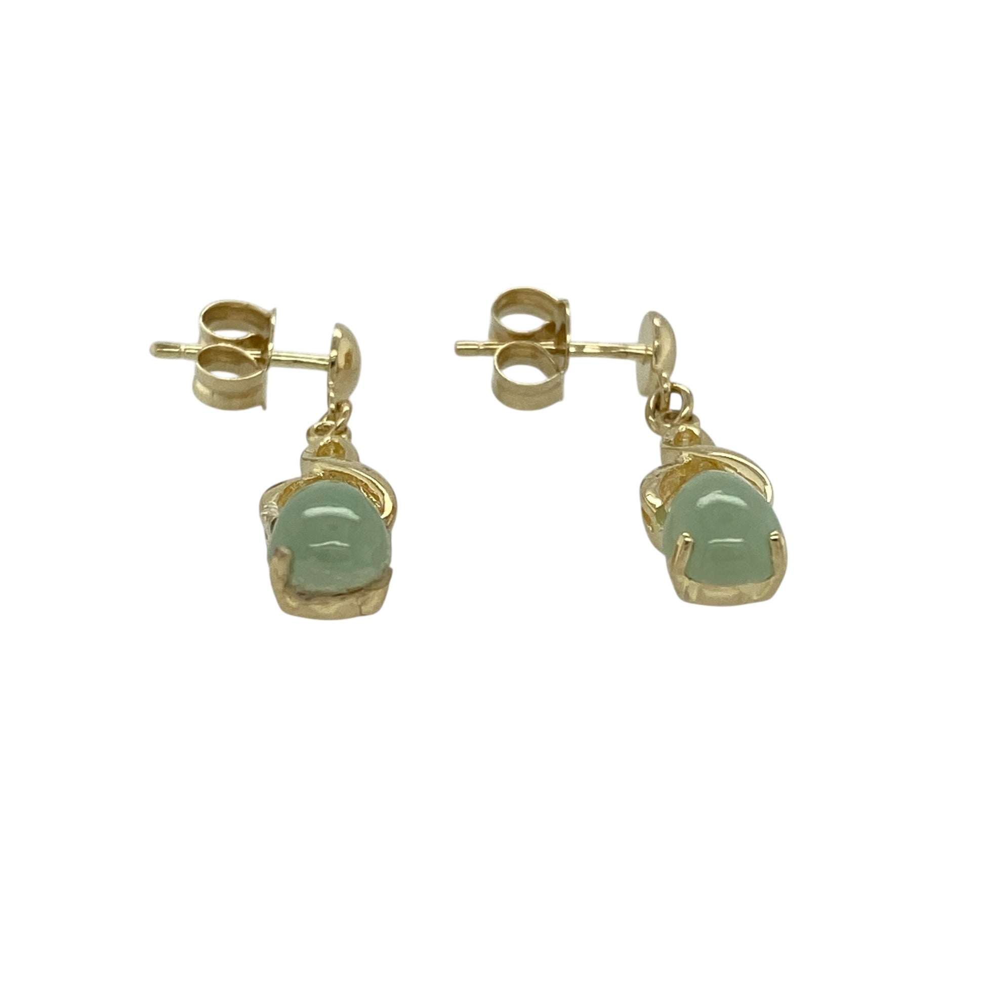 Add soft colour and elegant movement to your jewellery collection with this pre-owned 9ct yellow gold and jade set drop earrings, offering a timeless design with natural beauty—perfect for everyday wear or special occasions.

Design: The earrings feature classic drop styling set with oval jade stones, each measuring approximately 7mm by 5mm, creating a refined and graceful silhouette.