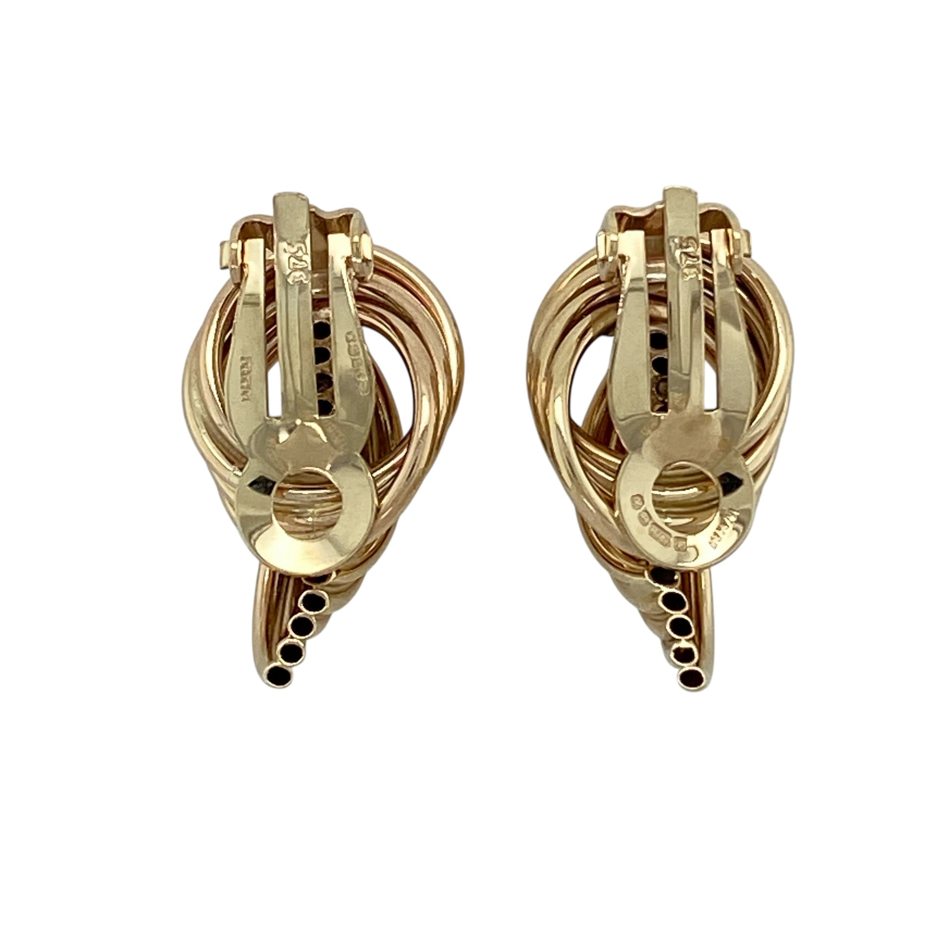 Add classic texture and effortless elegance to your jewellery collection with this pre-owned 9ct yellow gold tube twist style clip on earrings, offering a timeless design with a comfortable, secure fit.

Design: These earrings feature a tube twist style, creating a subtle yet eye-catching textured look that adds interest while remaining easy to wear.
Material: Made from 9-carat yellow gold, the warm polished finish enhances the twisted form and gives the earrings a traditional appeal.
