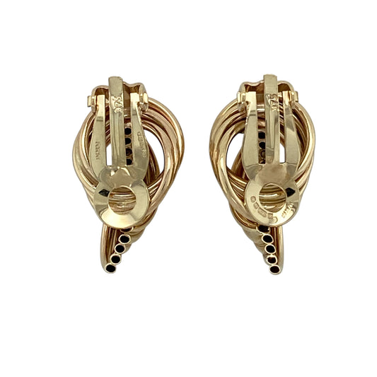 Add classic texture and effortless elegance to your jewellery collection with this pre-owned 9ct yellow gold tube twist style clip on earrings, offering a timeless design with a comfortable, secure fit.

Design: These earrings feature a tube twist style, creating a subtle yet eye-catching textured look that adds interest while remaining easy to wear.
Material: Made from 9-carat yellow gold, the warm polished finish enhances the twisted form and gives the earrings a traditional appeal.