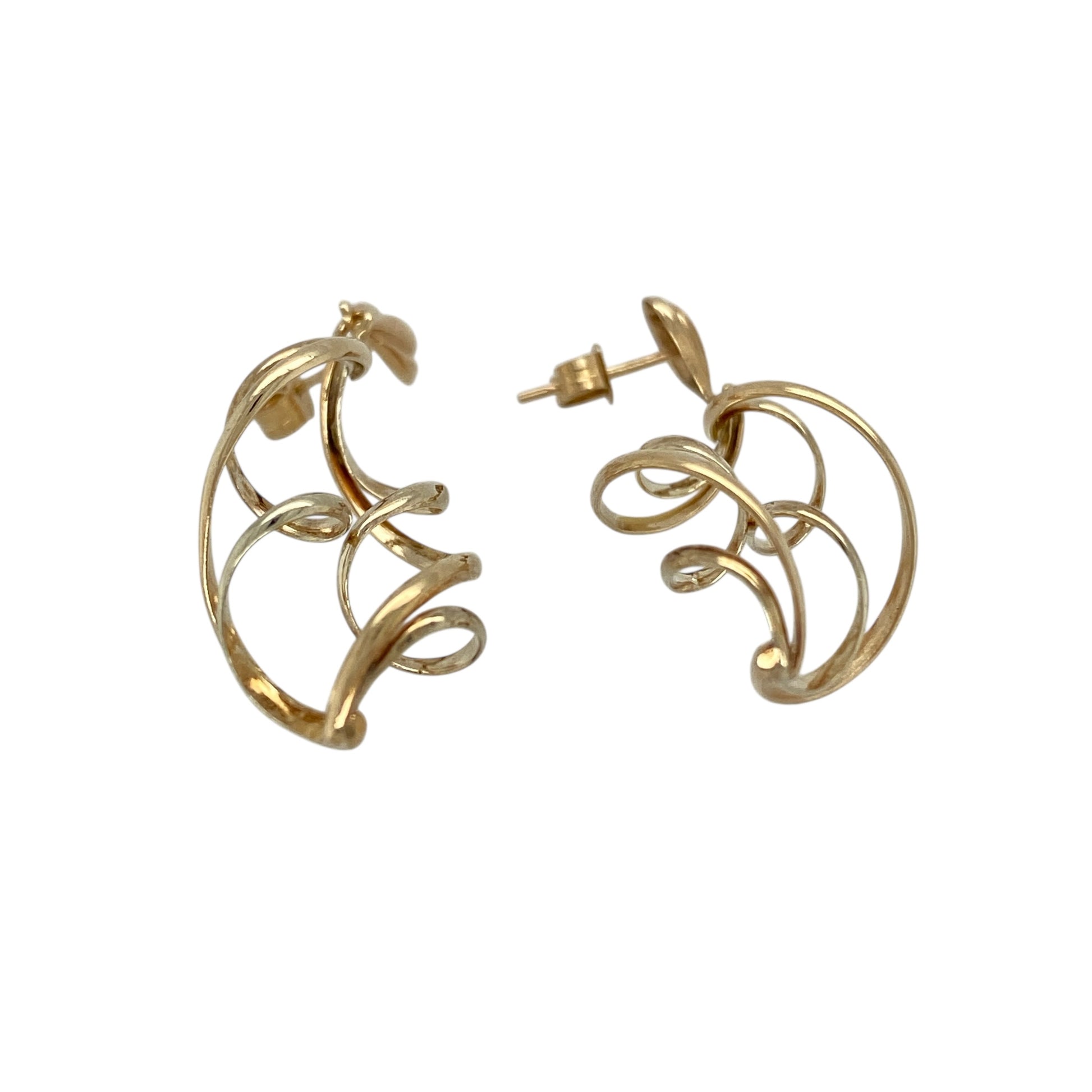 Add flowing elegance and classic charm to your jewellery collection with this pre-owned 9ct yellow gold swirl twist drop earrings, offering graceful movement and a timeless design.

Design: These drop earrings feature a swirl twist form, creating a fluid and eye-catching silhouette that moves beautifully when worn.
Material: Made from 9-carat yellow gold, the warm polished finish enhances the flowing curves and highlights the elegant shape.