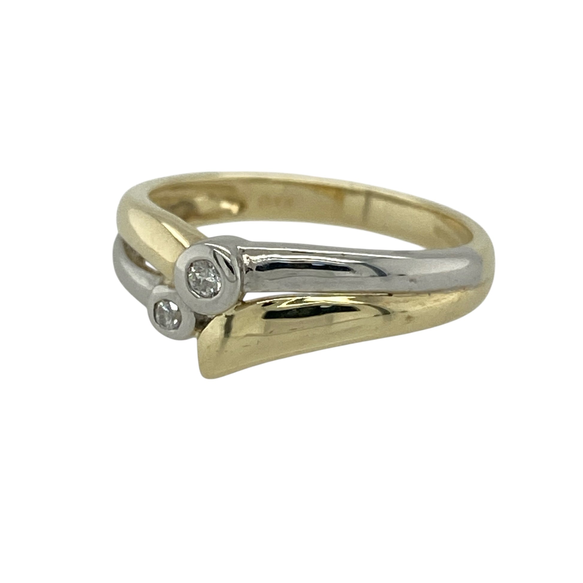 Add elegant contrast and subtle sparkle to your jewellery collection with this pre-owned 9ct yellow and white gold diamond wishbone style band ring, offering a graceful and contemporary design.

Design: This ring features a wishbone-style profile with double overlapping bands, creating a flowing and balanced look. Two diamonds accent the design, adding gentle sparkle while enhancing the elegant crossover form.