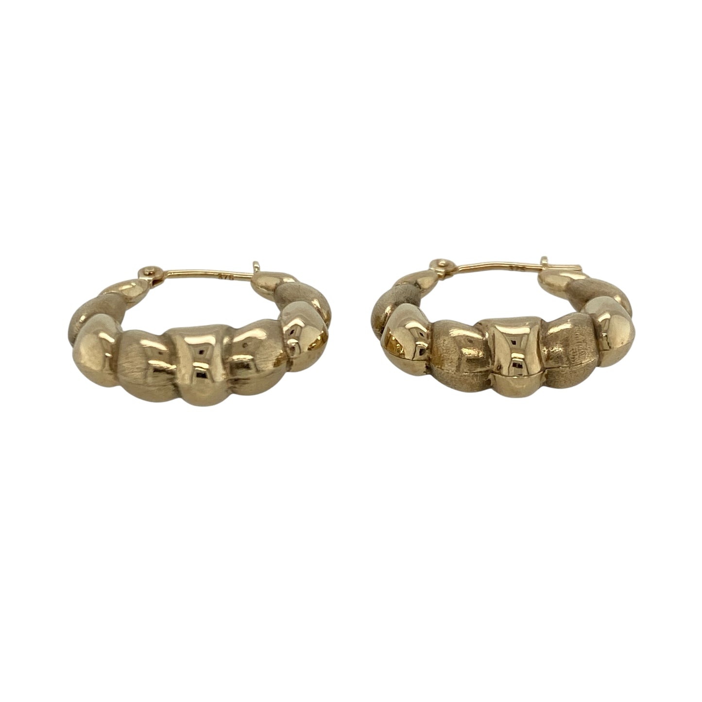 Add playful texture and classic charm to your jewellery collection with this pre-owned 9ct yellow gold bubble style oval creole earrings, offering a distinctive design with timeless appeal.

Design: These creole earrings feature an oval hoop shape with a bubble-style finish, creating a rounded, textured look that catches the light and adds visual interest.
Material: Made from 9-carat yellow gold, the warm polished finish enhances the bubble detailing and gives the earrings a classic appearance.