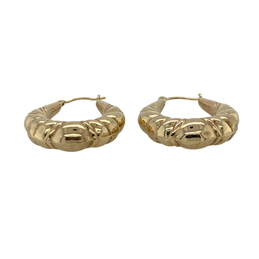 Add elegant texture and refined detail to your jewellery collection with this pre-owned 9ct yellow gold fancy twist patterned oval creole earrings, offering classic style with decorative appeal.

Design: These creole earrings feature an oval hoop shape with a fancy twist patterned finish, creating depth and visual interest while catching the light beautifully.
Material: Made from 9-carat yellow gold, the warm polished finish enhances the intricate twist detailing and gives the earrings a timeless look.