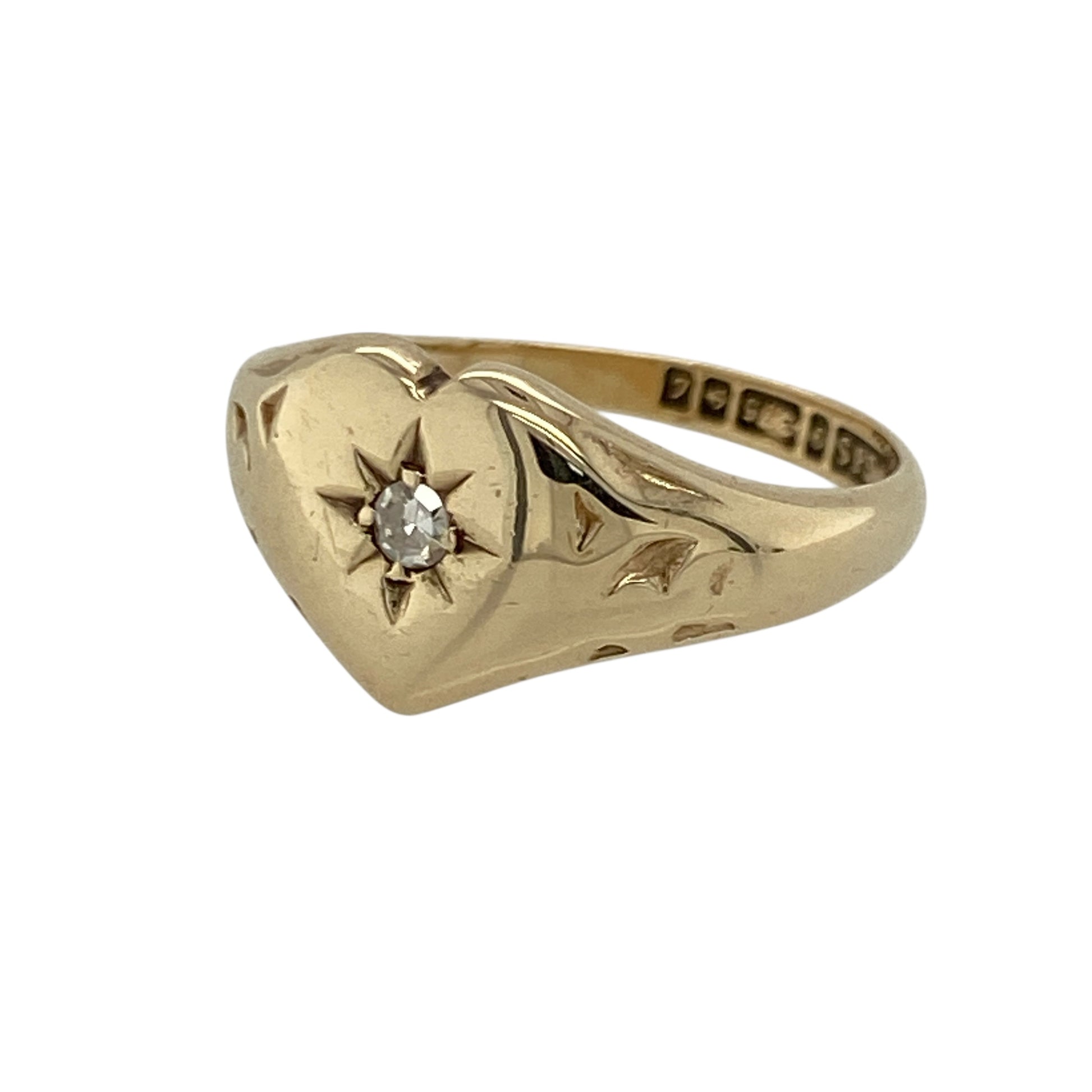 Add sentimental charm and classic sparkle to your jewellery collection with this pre-owned 9ct yellow gold diamond heart signet ring, offering timeless design with elegant detail.

Design: This ring features a heart-shaped signet front measuring approximately 10mm in height, with a diamond accent adding a touch of refined sparkle to the centre.
Material: Made from 9-carat yellow gold, the warm polished finish enhances the heart motif and gives the ring a traditional yet elegant appearance.