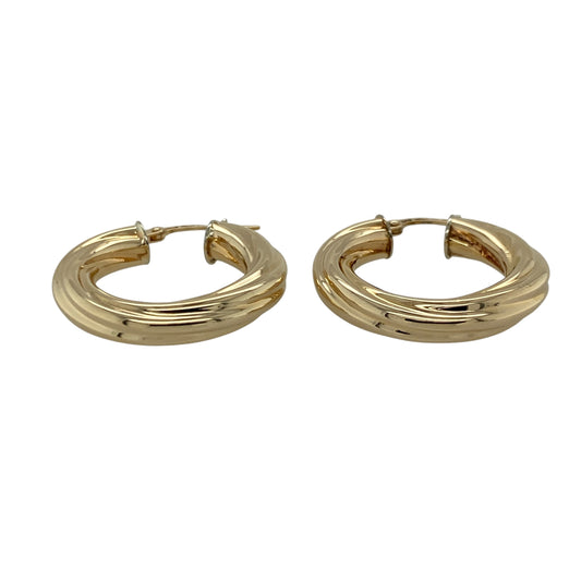 Add classic texture and timeless elegance to your jewellery collection with this pre-owned 9ct yellow gold twisted hoop creole earrings, offering a refined design with everyday appeal.

Design: These creole earrings feature a twisted hoop profile, creating subtle depth and visual interest while maintaining a traditional silhouette.
Material: Made from 9-carat yellow gold, the warm polished finish enhances the twisted detailing and gives the earrings lasting charm.
