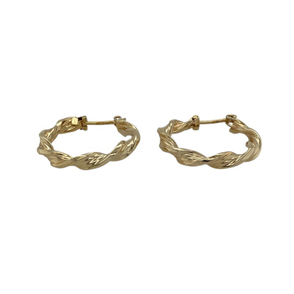 Add classic texture and timeless elegance to your jewellery collection with this pre-owned 9ct yellow gold twisted hoop creole earrings, offering refined detail with everyday appeal.

Design: These creole earrings feature a twisted hoop profile, creating subtle depth and visual interest while maintaining a traditional and versatile silhouette.
Material: Made from 9-carat yellow gold, the warm polished finish enhances the twisted detailing and gives the earrings lasting charm.