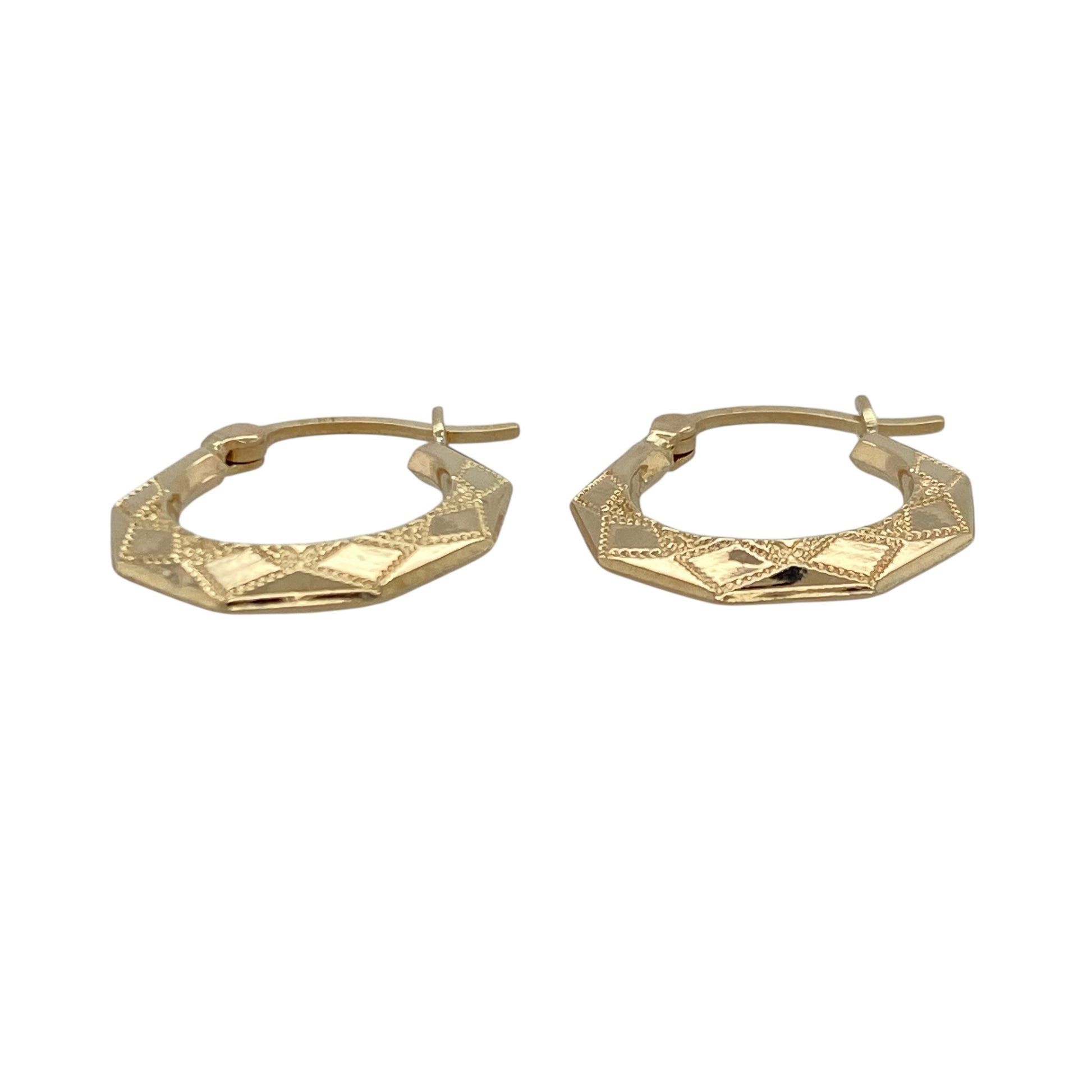 Add geometric detail and subtle texture to your jewellery collection with this pre-owned 9ct yellow gold patterned hexagon creole earrings, offering a modern twist on a classic style.

Design: These creole earrings feature a hexagon-inspired hoop shape with a patterned finish, creating light-catching texture and distinctive visual interest.
Material: Made from 9-carat yellow gold, the warm polished tone enhances the geometric profile and highlights the intricate detailing.