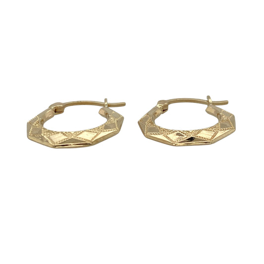 Add geometric detail and subtle texture to your jewellery collection with this pre-owned 9ct yellow gold patterned hexagon creole earrings, offering a modern twist on a classic style.

Design: These creole earrings feature a hexagon-inspired hoop shape with a patterned finish, creating light-catching texture and distinctive visual interest.
Material: Made from 9-carat yellow gold, the warm polished tone enhances the geometric profile and highlights the intricate detailing.