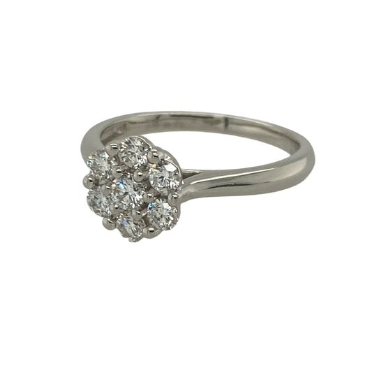 Embrace timeless elegance with this pre-owned platinum and diamond set flower cluster ring, showcasing exceptional sparkle in a classic floral-inspired design. A refined and luxurious choice for special occasions or everyday sophistication.

Design: The ring features seven brilliant-cut diamonds arranged in a flower cluster formation, creating a beautifully balanced and eye-catching focal point.