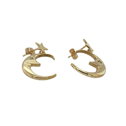 Add celestial charm and delicate sparkle to your jewellery collection with these pre-owned 9ct yellow gold and cubic zirconia set crescent moon and star drop earrings, offering graceful movement and eye-catching detail. Perfect for both everyday styling and evening wear.

Design: Each earring features a crescent moon and star motif in a drop design, symbolising guidance and light. The flowing silhouette creates elegant movement, while the star detailing adds a playful yet refined finish.