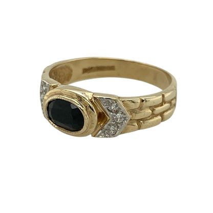 Add distinctive style to your jewellery collection with this pre-owned 9ct yellow and white gold sapphire and cubic zirconia set watch style band ring, combining bold design with vibrant colour and sparkle. A unique piece perfect for making a statement.

Design: The ring features a 7mm by 5mm oval-cut sapphire as its centrepiece, set within a watch style band design that creates a structured and eye-catching profile.