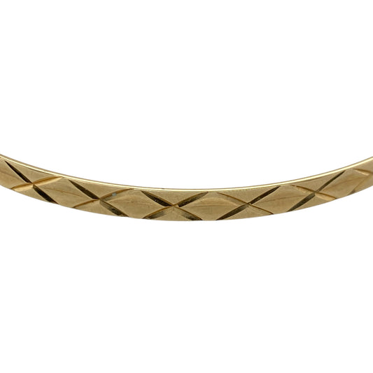 Add classic elegance to your jewellery collection with this pre-owned 9ct yellow solid gold diamond cut patterned bangle, offering timeless style with eye-catching texture. A versatile piece perfect for everyday wear or layering with other bangles.

Design: The bangle measures approximately 4mm in width and features a diamond cut patterned finish, creating a faceted effect that reflects light beautifully. The detailed surface adds subtle sparkle while maintaining a refined and wearable profile.