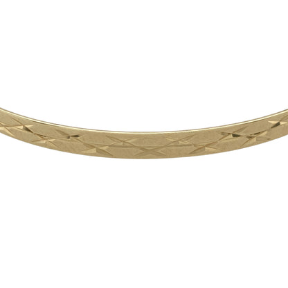 Add refined sparkle to your jewellery collection with this pre-owned 9ct yellow solid gold diamond cut patterned bangle, combining classic style with light-catching detail. A timeless piece ideal for everyday wear or elegant layering.

Design: Measuring approximately 4mm in width, the bangle features a diamond cut patterned finish that creates a faceted surface, reflecting light beautifully with every movement. The slim yet defined profile offers a balanced and sophisticated look on the wrist.