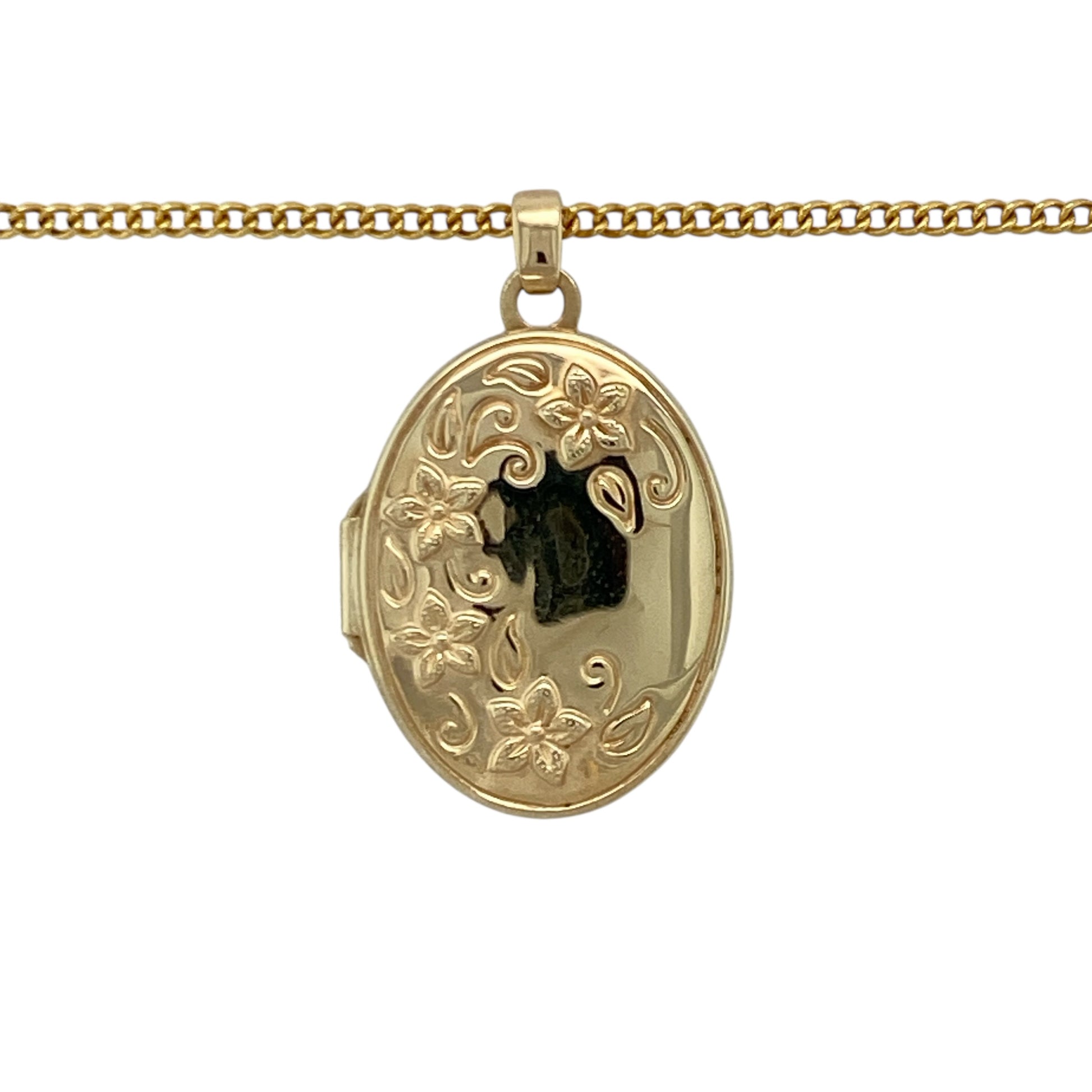 Keep cherished memories close with this pre-owned 9ct yellow gold flower patterned oval locket necklace, combining sentimental value with timeless elegance. A beautiful piece perfect for everyday wear or meaningful gifting.

Design: The pendant is crafted in a classic oval shape and features an engraved floral pattern across the front, adding delicate texture and vintage-inspired charm. Measuring approximately 2.7cm in length including the bail, it offers a noticeable yet refined presence on the neckline.