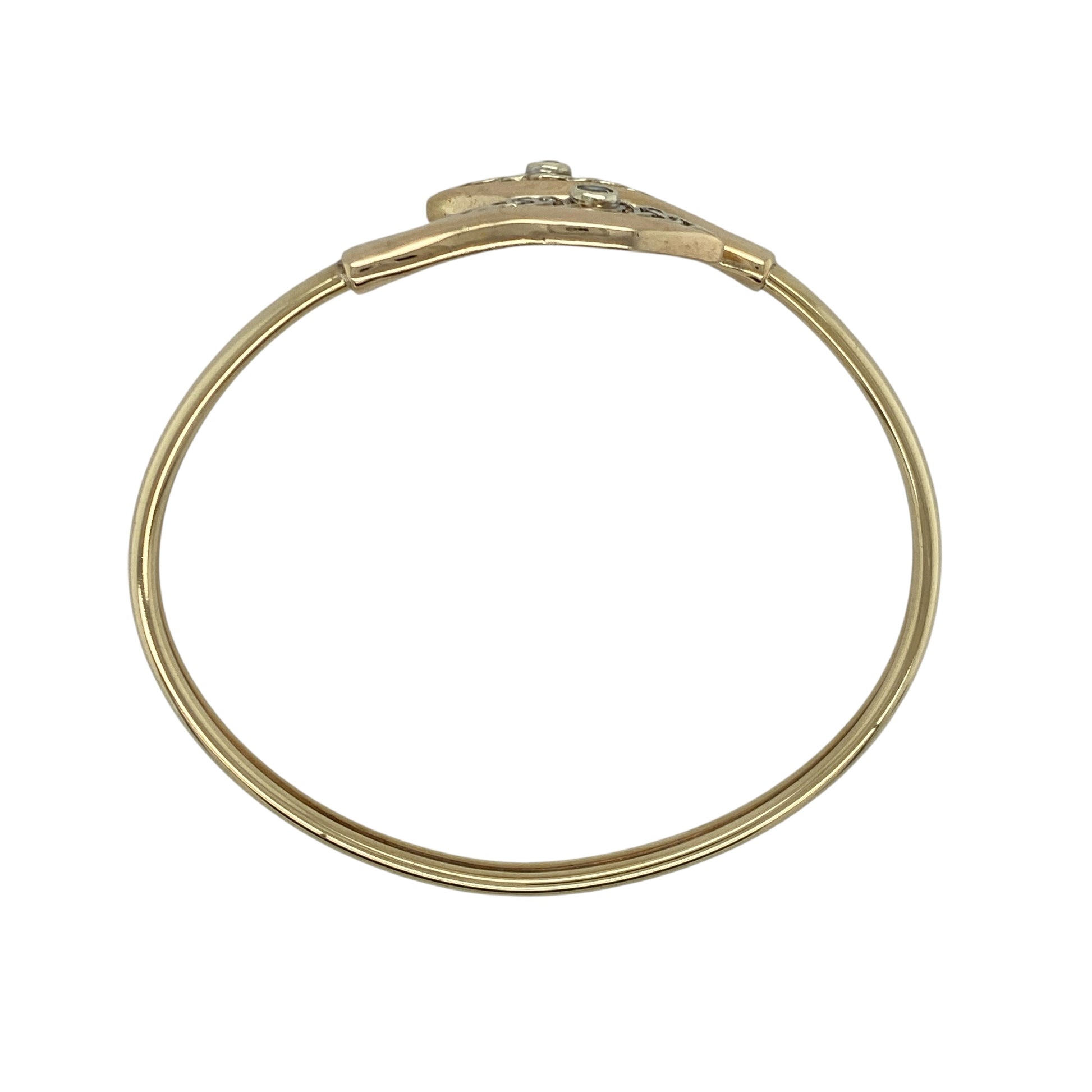 Embrace meaningful design with this pre-owned 9ct yellow and white gold blue stone set Clogau Celtic Knot wrap over bangle, combining heritage symbolism with elegant two-tone styling. A striking piece perfect for everyday wear or special occasions.

Design: The bangle features a graceful wrap over style adorned with the iconic Celtic knot motif, symbolising eternity and unity.