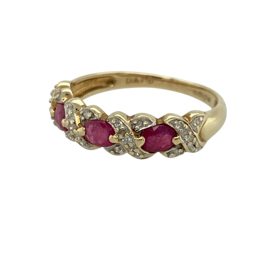 Add rich colour and intricate detail to your jewellery collection with this pre-owned 9ct yellow gold diamond and ruby set band ring, combining classic gemstones with decorative styling. A beautiful piece perfect for everyday wear or special occasions.

Design: The ring features oval-cut rubies measuring approximately 4mm by 3mm, arranged along the band. Between each ruby sits a diamond-set cross motif, adding delicate sparkle and distinctive character to the overall design.