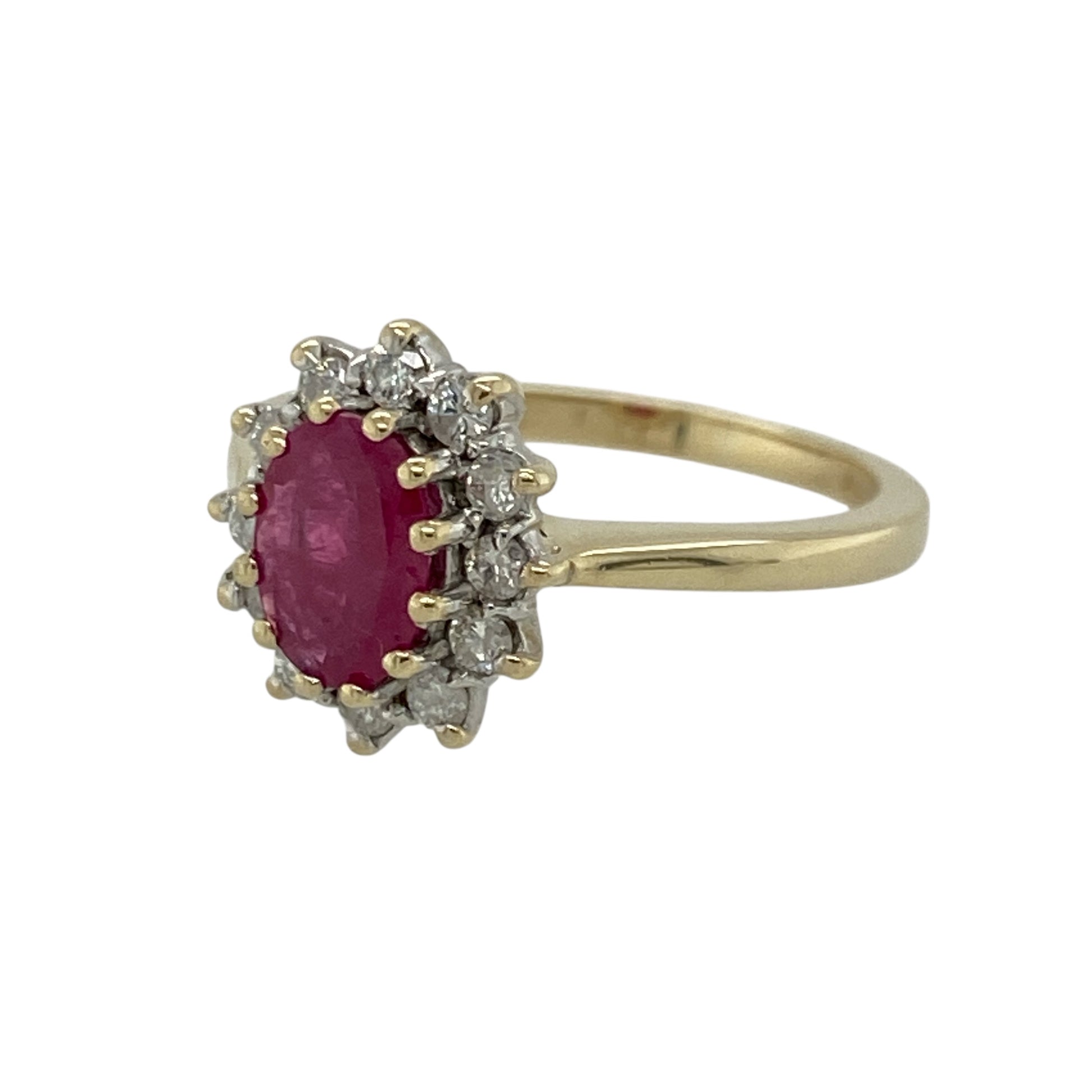 Add timeless elegance and vibrant colour to your jewellery collection with this pre-owned 9ct yellow gold diamond and ruby set cluster ring, showcasing classic styling with eye-catching brilliance. A beautiful piece perfect for special occasions or refined everyday wear.

Design: The ring features a striking 7mm by 5mm oval-cut ruby at its centre, surrounded by a sparkling diamond cluster.