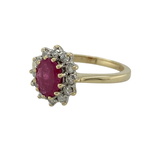 Add timeless elegance and vibrant colour to your jewellery collection with this pre-owned 9ct yellow gold diamond and ruby set cluster ring, showcasing classic styling with eye-catching brilliance. A beautiful piece perfect for special occasions or refined everyday wear.

Design: The ring features a striking 7mm by 5mm oval-cut ruby at its centre, surrounded by a sparkling diamond cluster.