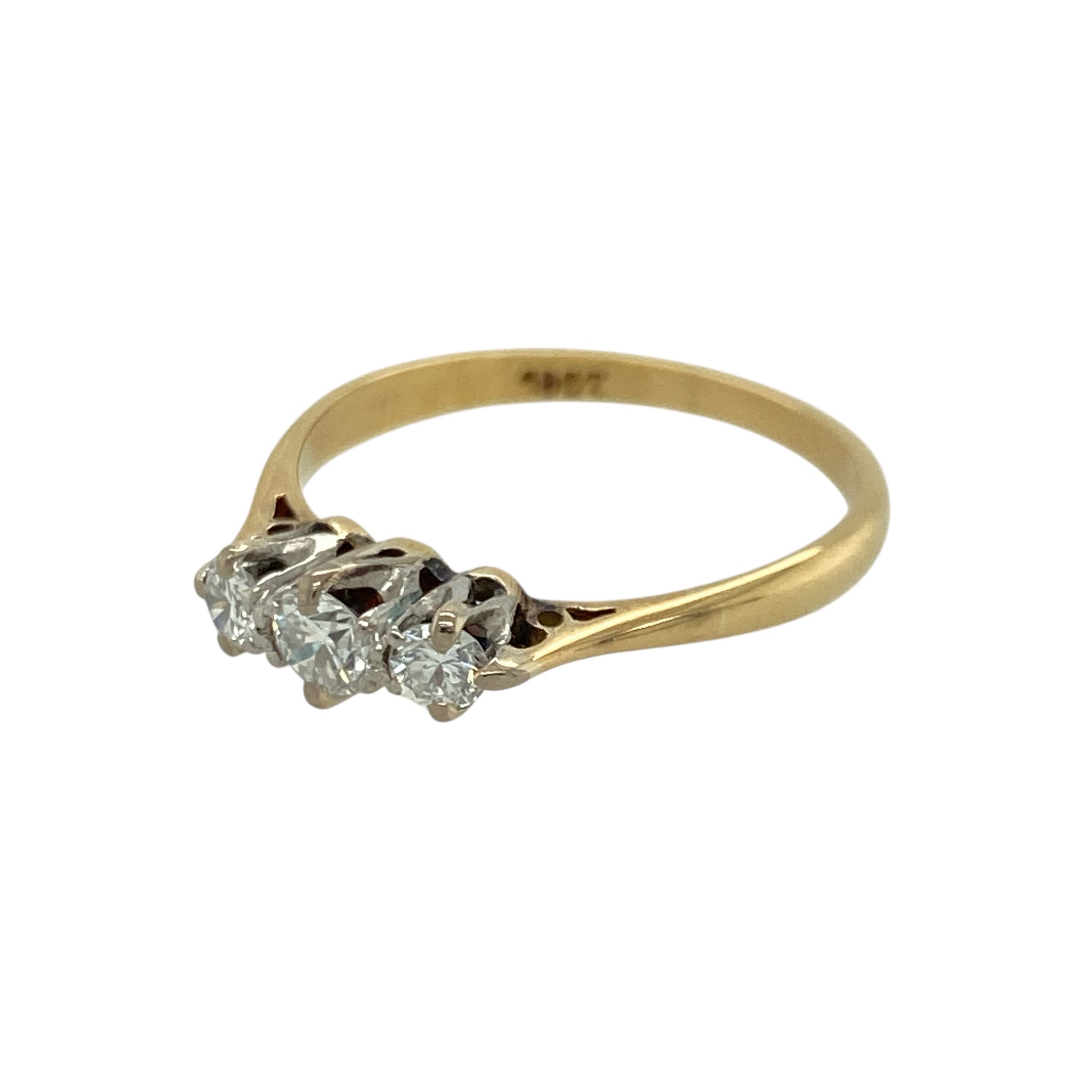 Add refined sparkle to your jewellery collection with this pre-owned 18ct yellow gold diamond set trilogy ring, showcasing classic three-stone styling with timeless appeal. A beautiful piece ideal for everyday elegance or a meaningful gift.

Design: The ring features a traditional trilogy arrangement of three diamonds, symbolising past, present and future. With approximately 0.20ct of total diamond content, the stones offer balanced brilliance and a clean, elegant profile across the finger.