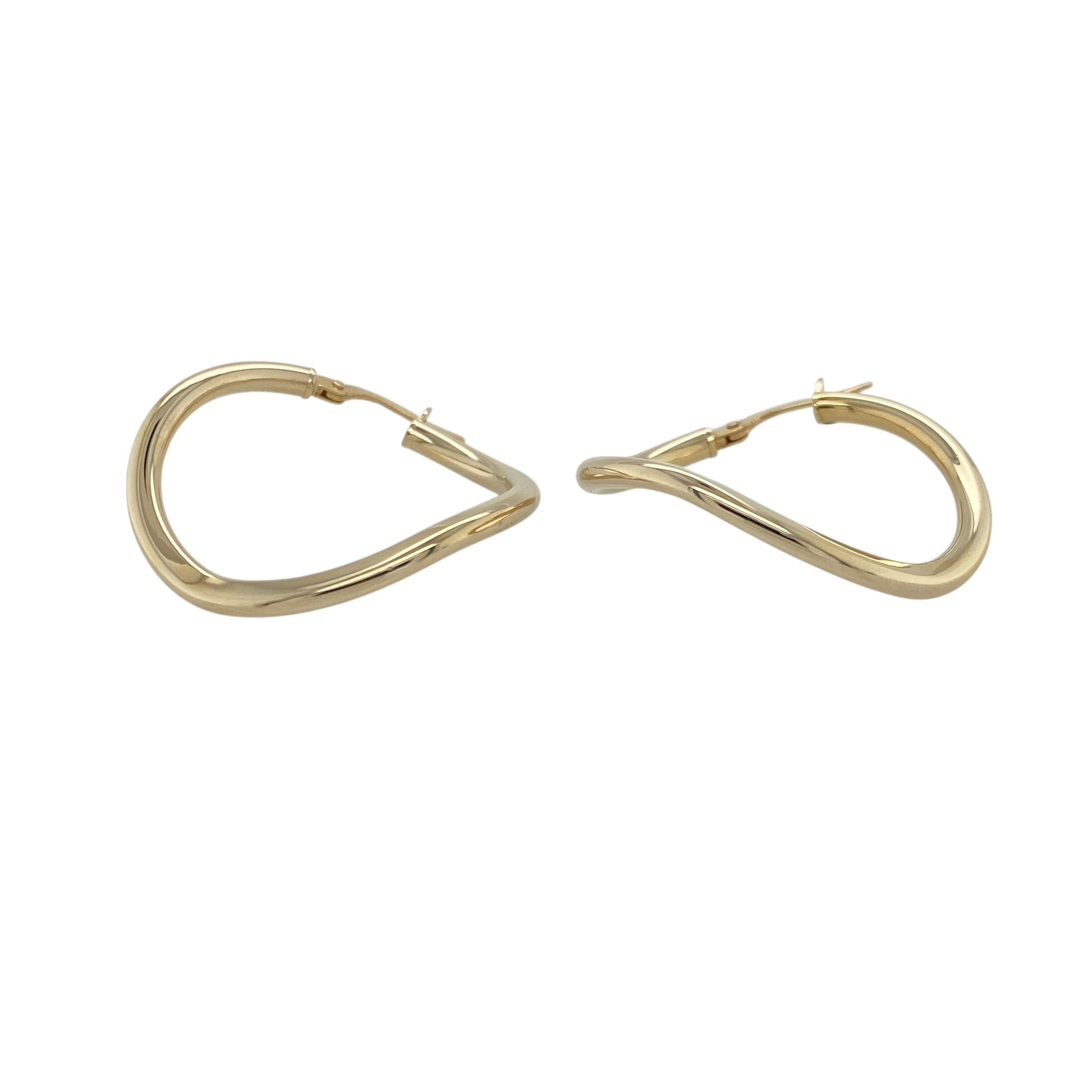 Add subtle movement and modern style to your jewellery collection with these pre-owned 9ct yellow gold wave hoop creole earrings, offering a contemporary twist on a classic hoop design. A versatile pair perfect for everyday wear.

Design: The earrings feature a traditional creole hoop silhouette enhanced by a gentle wave pattern flowing around the hoop. The curved detailing creates soft dimension and light reflection while maintaining a refined and wearable profile.