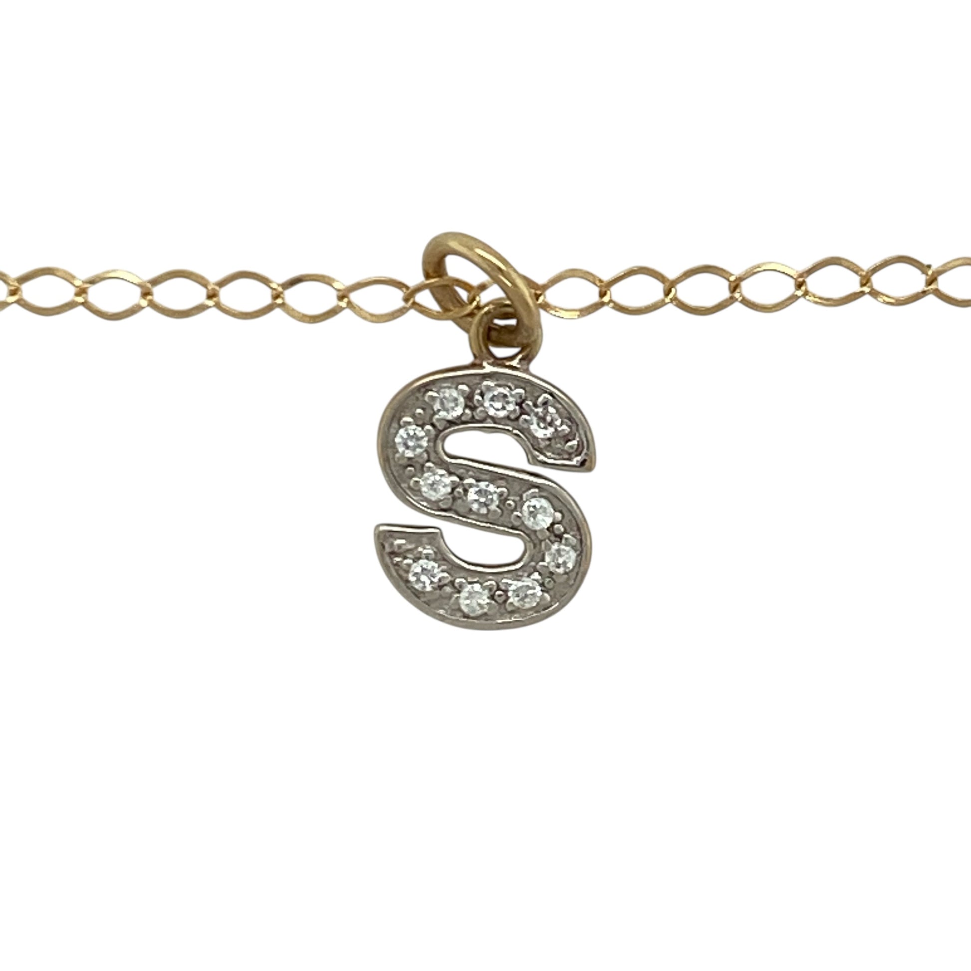 Add a personalised touch to your jewellery collection with this pre-owned 9ct yellow and white gold cubic zirconia set initial “S” pendant necklace. A meaningful and stylish piece perfect for everyday wear or gifting.

Design: The pendant is shaped as the letter “S” and measures approximately 1.7cm in length including the bail. Sparkling cubic zirconia stones are set within the design, adding eye-catching brilliance while maintaining a refined and elegant profile.