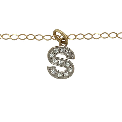 Add a personalised touch to your jewellery collection with this pre-owned 9ct yellow and white gold cubic zirconia set initial “S” pendant necklace. A meaningful and stylish piece perfect for everyday wear or gifting.

Design: The pendant is shaped as the letter “S” and measures approximately 1.7cm in length including the bail. Sparkling cubic zirconia stones are set within the design, adding eye-catching brilliance while maintaining a refined and elegant profile.