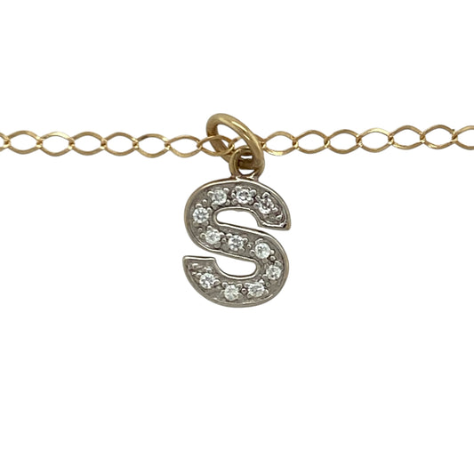 Add a personalised touch to your jewellery collection with this pre-owned 9ct yellow and white gold cubic zirconia set initial “S” pendant necklace. A meaningful and stylish piece perfect for everyday wear or gifting.

Design: The pendant is shaped as the letter “S” and measures approximately 1.7cm in length including the bail. Sparkling cubic zirconia stones are set within the design, adding eye-catching brilliance while maintaining a refined and elegant profile.