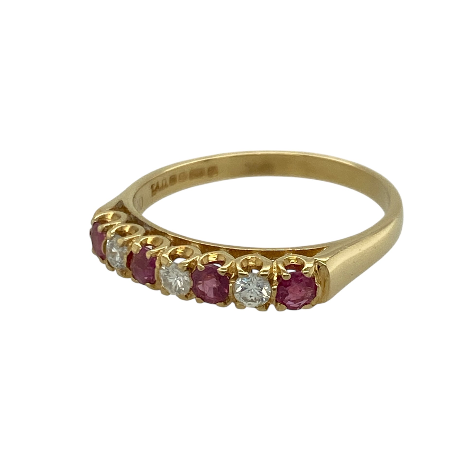 Add vibrant colour and refined brilliance to your jewellery collection with this pre-owned 18ct yellow gold diamond and ruby set band ring, combining classic gemstones with a luxurious finish. A striking piece perfect for special occasions or elegant everyday wear.

Design: The band is set with round rubies measuring approximately 3mm in diameter, complemented by sparkling diamonds totalling approximately 0.24ct.