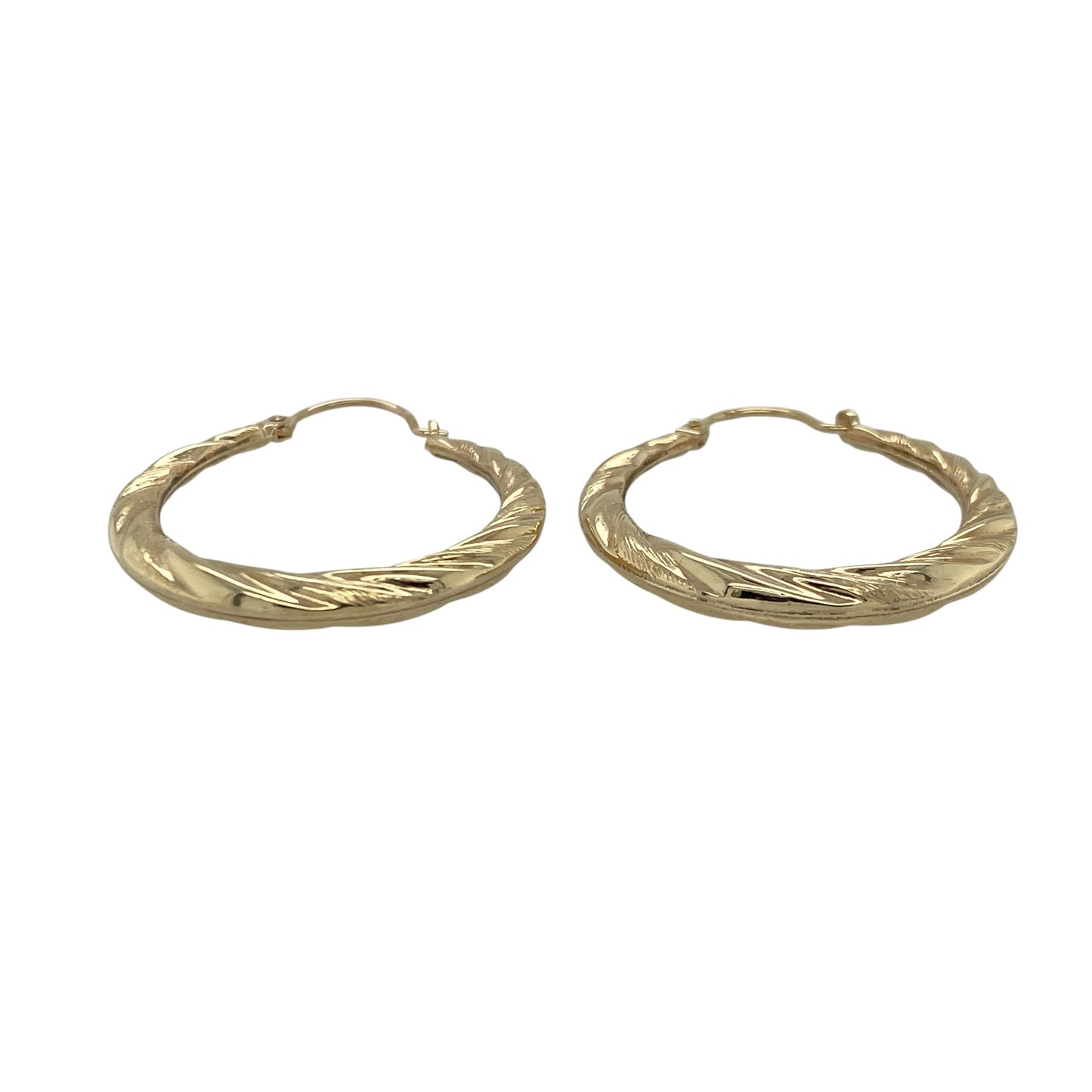 Add effortless elegance to your jewellery collection with these pre-owned 9ct yellow gold twisted hoop creole earrings, offering timeless styling with subtle texture. A versatile pair perfect for everyday wear or easy day-to-evening accessorising.

Design: The earrings feature a classic hoop creole silhouette enhanced by a gentle twisted design. The flowing curves create light-catching detail, giving the hoops added dimension while maintaining a refined and wearable profile.